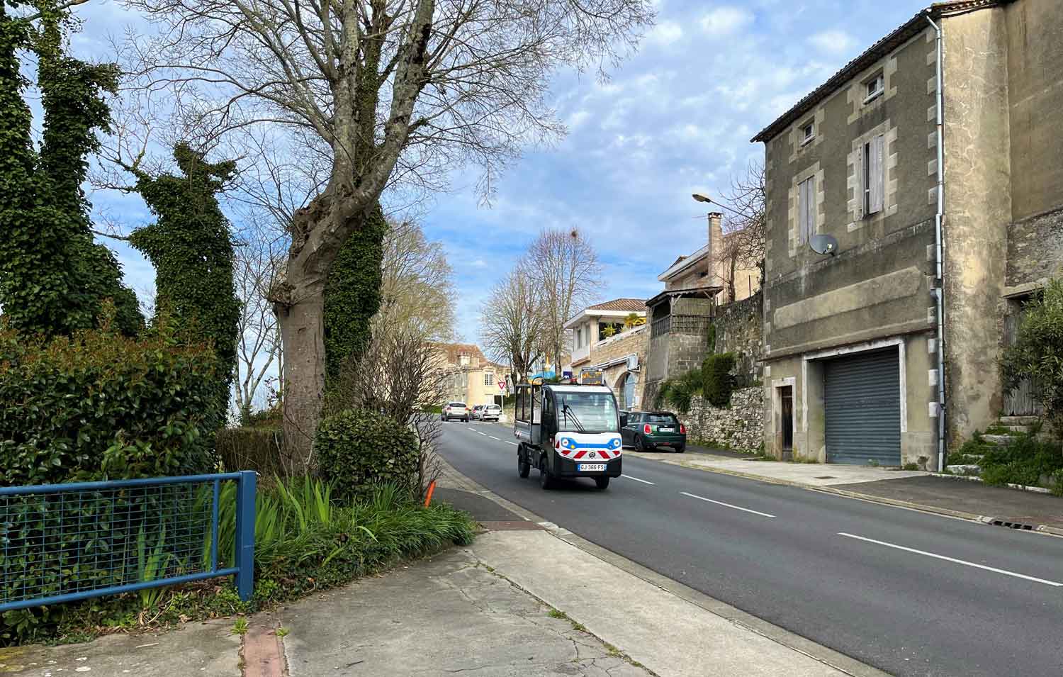 Goupil G4 driving through a residential area